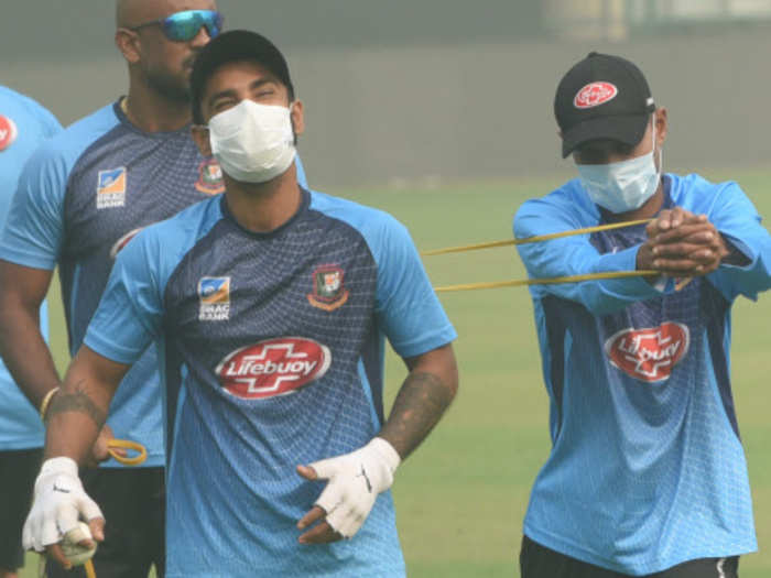 Bangladeshi cricketers wear masks during a practice session at Arun Jaitley Stadium before the match on Sunday.