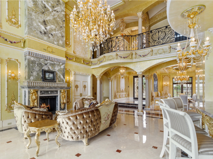 The opulent Florida mansion features a gold-plated and Swarovski crystal chandelier.