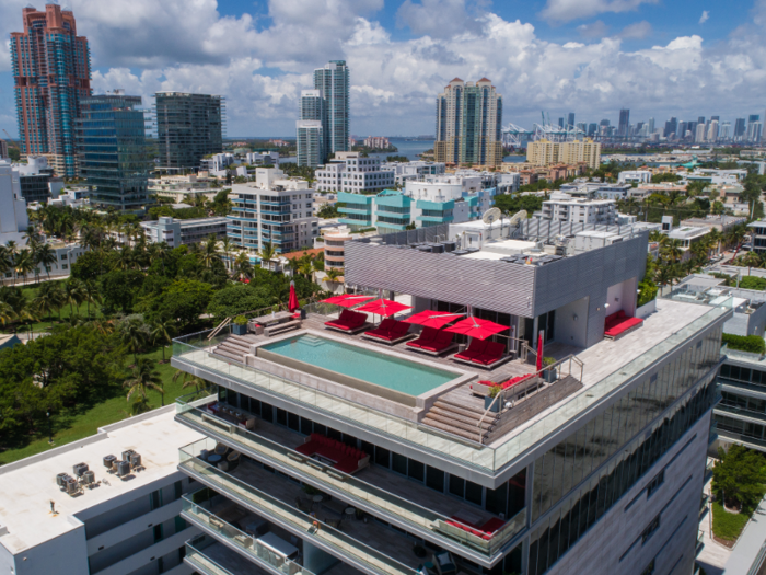 The rooftop pool deck also comes equipped with a grilling area.