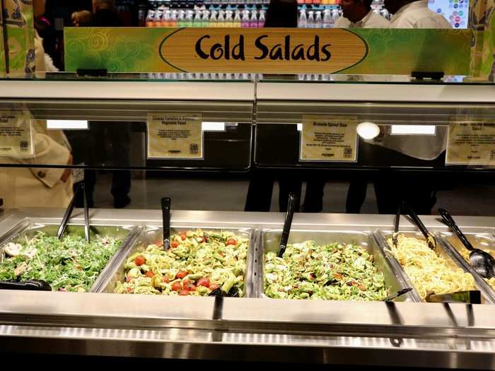 In addition to the counters holding piles of fresh food, there are also different stations that shoppers can pick and choose from. We found everything from a cold salad bar ...