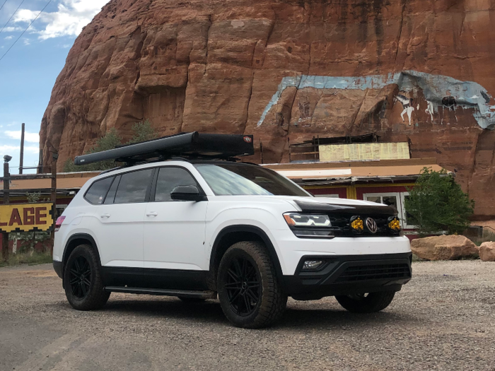 The rooftop rack and tent, awning, bike rack, and upgraded lights make it outdoor-ready.