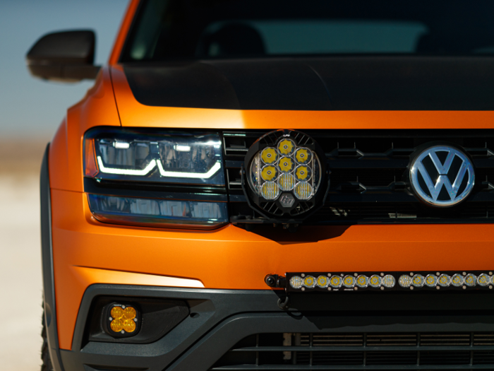 It has a custom orange wrap and additional lighting equipment to amplify the off-roading theme.