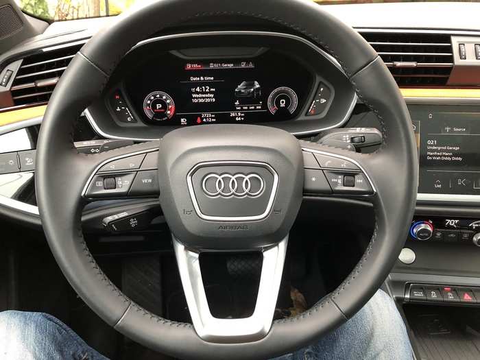 The stitched, leather-wrapped steering wheel sported the usual array of multifunction buttons and thumbwheels, with paddle-shifters for spirited motoring.