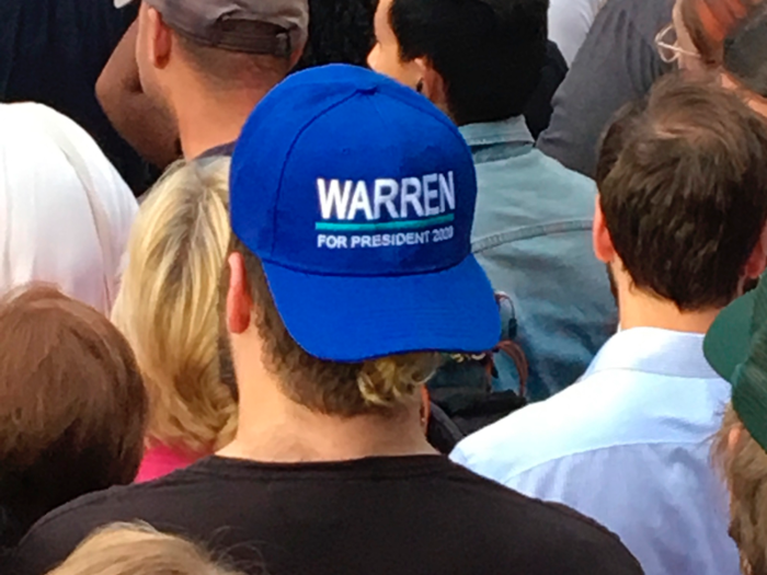 Warren supporters wore blue hats.