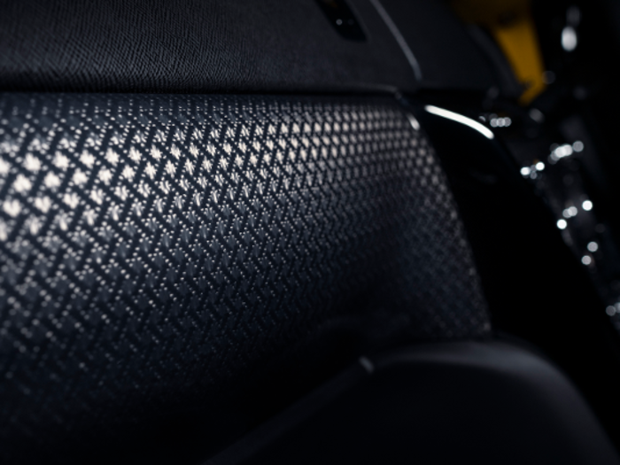 It also has a woven carbon-fiber finish that the automaker says produces a three-dimensional effect.