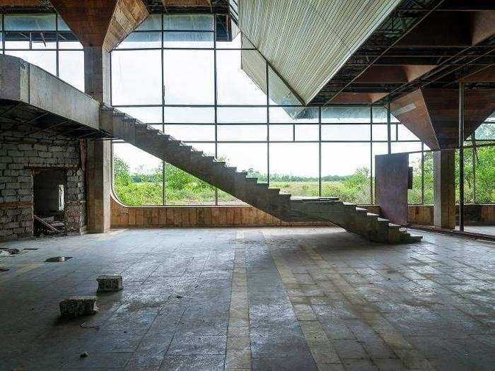 Concrete staircases leading to an empty upper level were some of the only structures I saw standing.