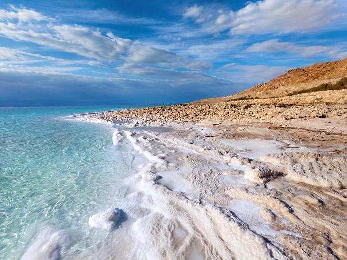 Drought conditions have caused the Dead Sea, which borders Jordan, Israel, and Palestine, to shrink and collapse.