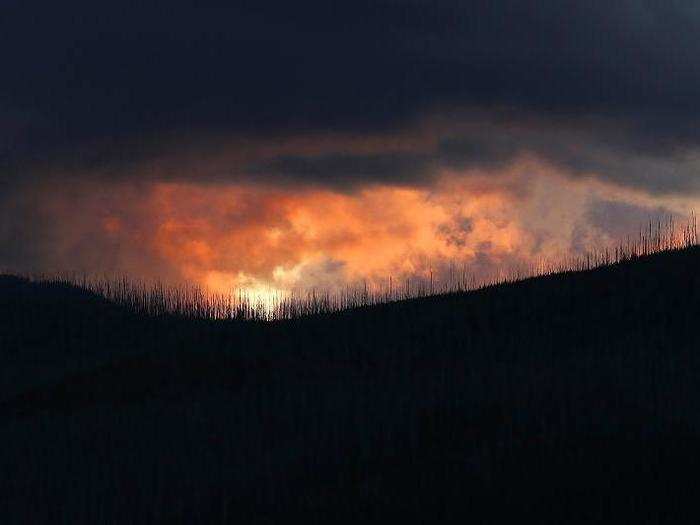 Glacier National Park has also been hit by wildfires as fire season grows longer in the western US. In 2018, the Howe Ridge Fire tore through the park