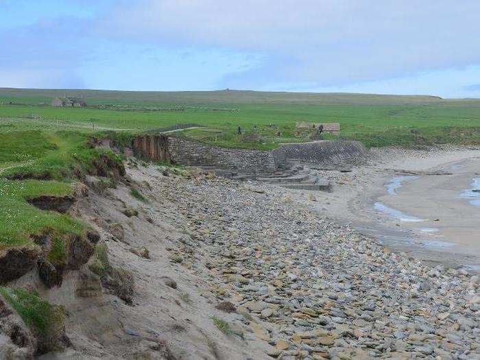 Skara Brae is exposed to heavy rains and frequent storms. The land is also eroding due to sea-level rise.