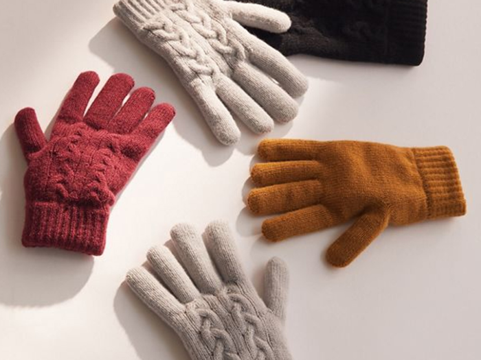 A pair of cable-knit gloves for cold hands