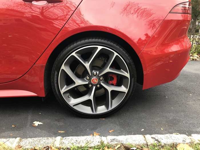 The 20-inch,10-Spoke Style "Satin Grey Diamond Turned Wheels" hide red brake calipers.