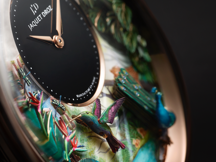 It features delicately hand-crafted birds and scenery.