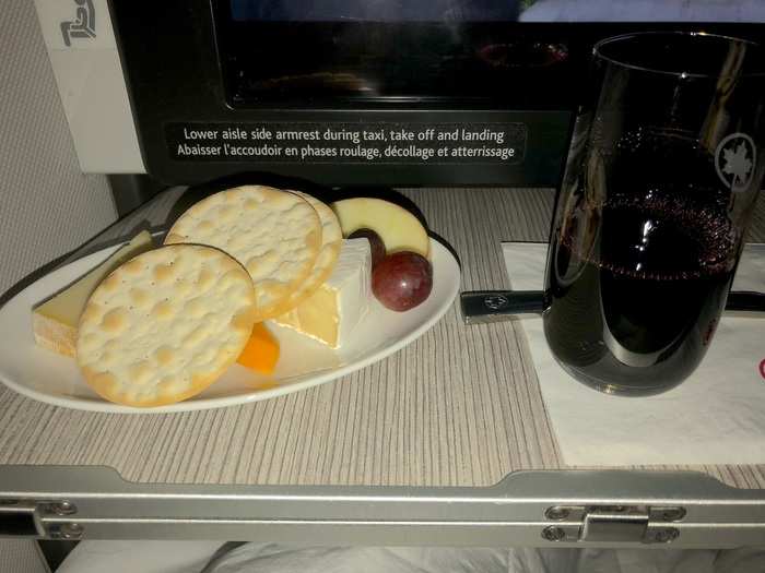 After the towel, flight attendants came around offering a cheese plate and a port wine to pair with it. More snacks followed, like a dish of mixed nuts and traveler