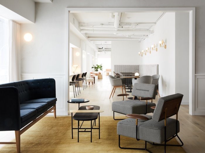 Around the corner from the kitchen is a bright hallway filled with work and study spaces, including a row of desks overlooking Lexington Avenue.