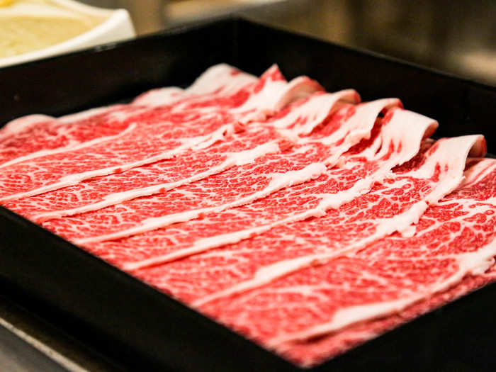 The wagyu beef was deep red and marbled with flecks and patches of snow-white fat.