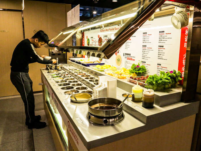 The sauce bar was loaded with sauces, fruits, appetizers, porridge, and even dessert.