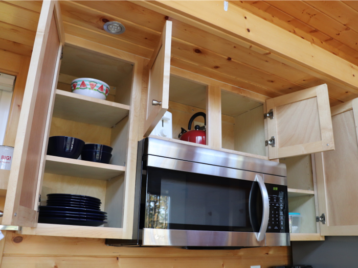 There were six cabinet doors and four drawers in the tiny house kitchen, as well as a shelf — and they seemed to fit all the necessities quite nicely.