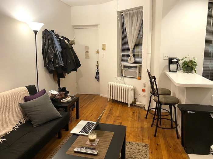 My living room only has one window, and it yields a classic NYC view: The apartment building next door and the garbage cans in between them.