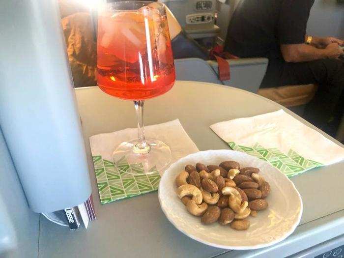 Right after that, he brought my aperol spritz with a dish of warm mixed nuts.