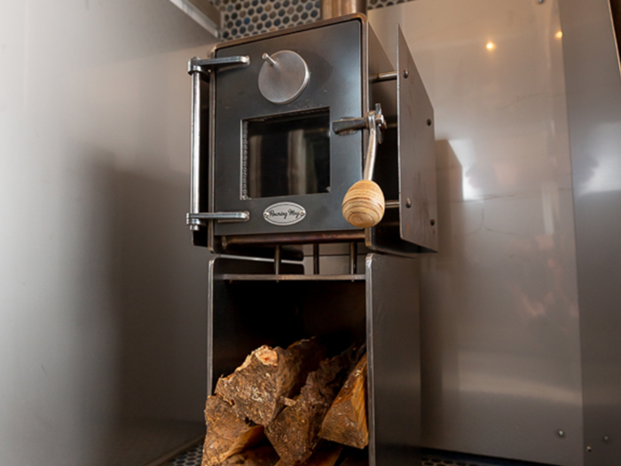 ...and a wood-burner in between the kitchen and bed.