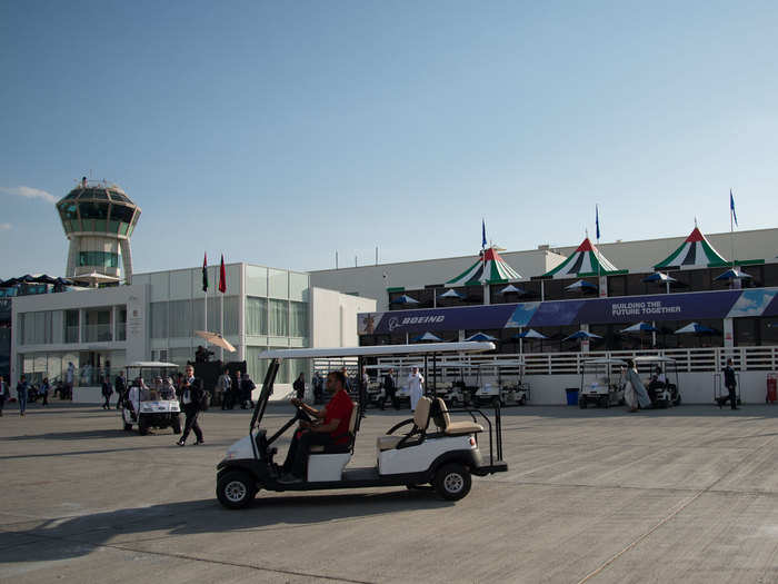 All these planes take up a lot of space, and Dubai, even in November, is really hot. So most people travel up and down the runway in golf carts.