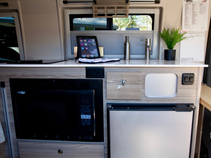 The kitchen comes with a refrigerator and freezer unit, stainless steel sink with a cover and bamboo cutting board…