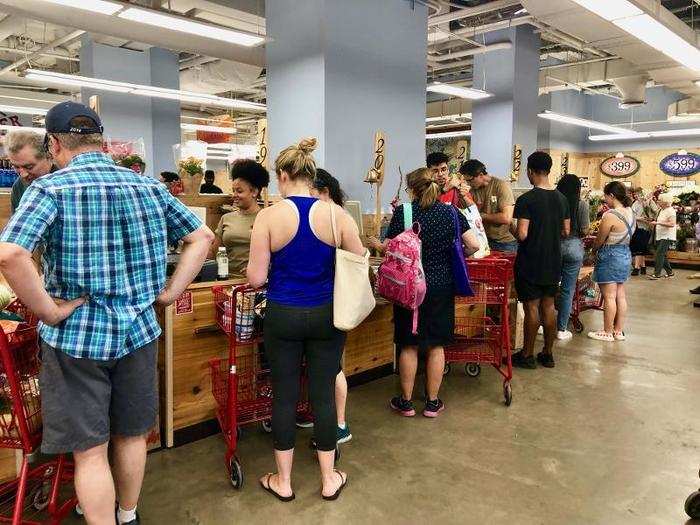 At the checkout area, the line was long but it moved surprisingly fast. Here, employees raised a numbered paddle to signify their lane was open.