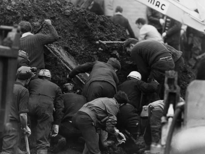 Hundreds of people began to dig. Miners still had their headlamps on.