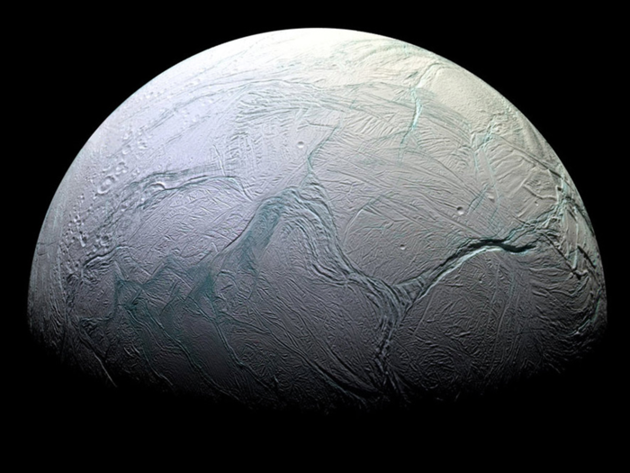 The second world, Enceladus, is an icy moon of Saturn.