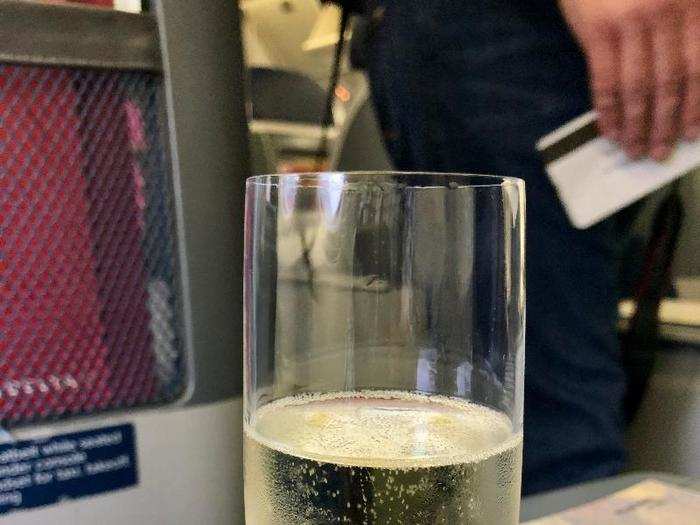 A few minutes later, the main flight attendant working my side of business class, Christopher, came over to introduce himself and offered me a glass of either sparkling wine, orange juice, or water as the plane boarded.