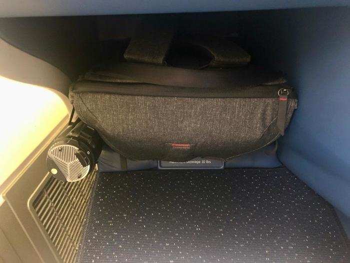 ... And a cubby under the seat in front of me, although this is where a passenger