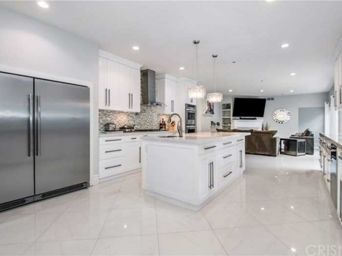 And, yeah, the fridge looks like it holds enough food to feed Shaq.