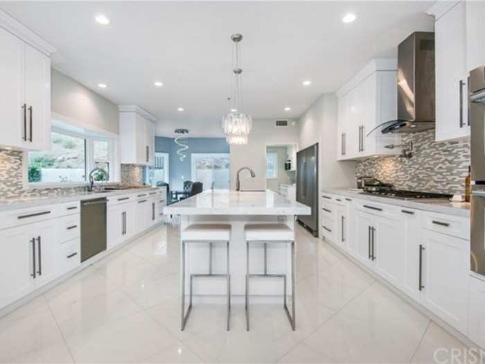 The stunning kitchen is similarly bright and airy.