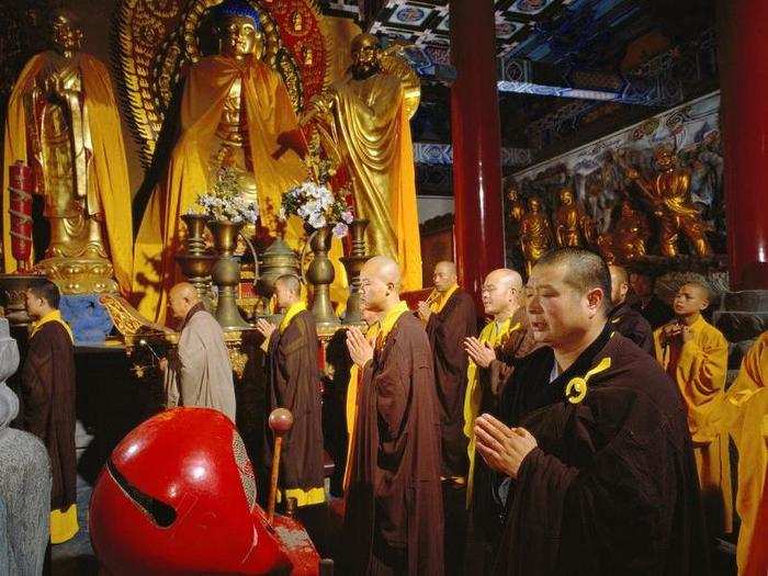 Before dawn, monks say their morning prayers and chants.