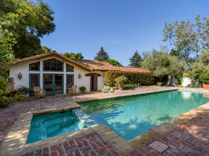 ... and a pool, with an accompanying pool house that is detached from the main residence.