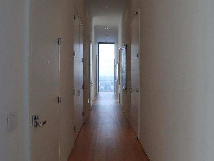 In this particular penthouse, the bedrooms and bathrooms are located down this hallway.