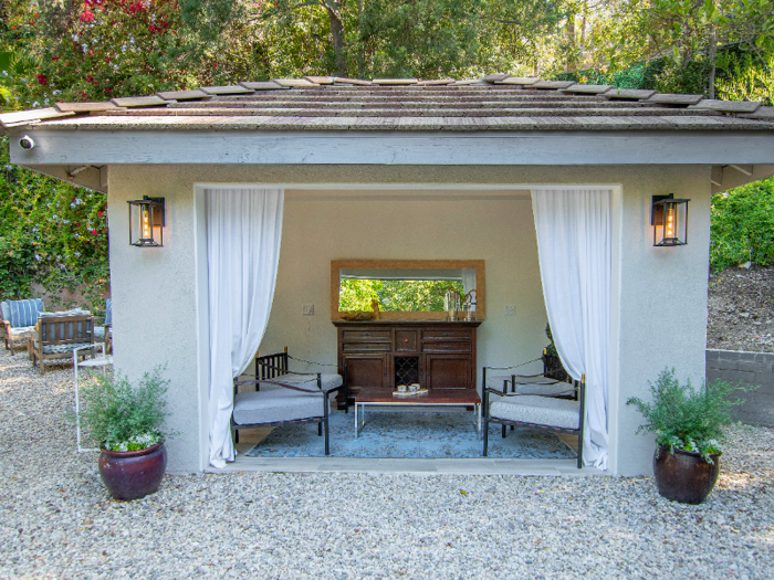 The home also has a comfy lounging area near the pool ...