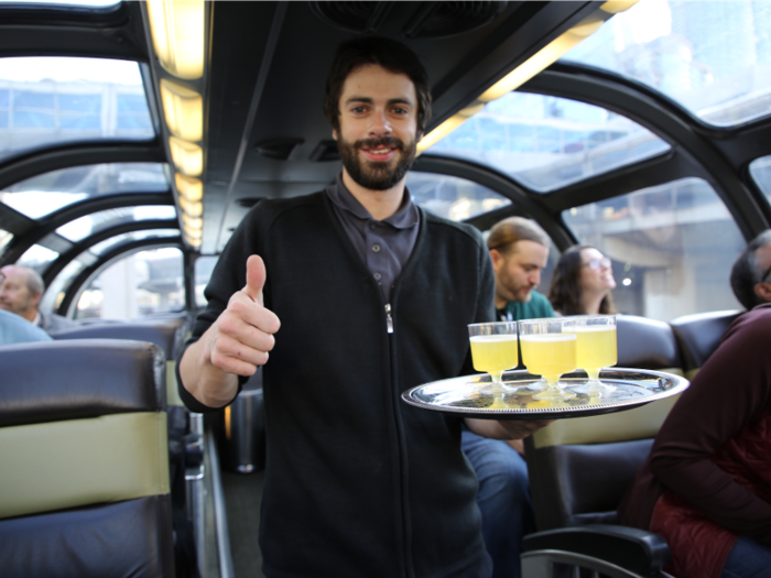 As the train started to move, Colin — the staff member assigned to look after the folks in my Skyline car— came around with welcome mimosas and introduced himself.