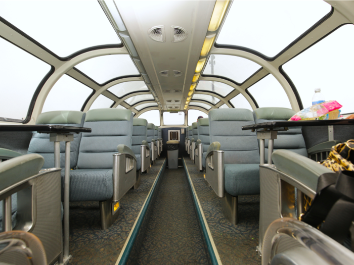 Economy passengers have access to a lofted dome seating area in their Skyline car. But the partially-cloth seats and faded colors made it look a bit more tired than the one I used in business class.