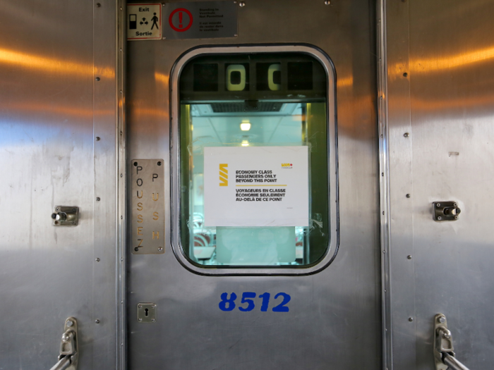 Finally, I made my way to Economy class — the low-cost ticket option. There was a sign on the door between cars that read "Economy Class Passengers Only Beyond This Point," but I just walked through.