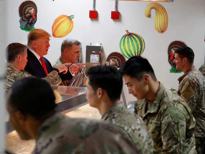 Trump had time to serve turkey and mashed potatoes to the troops.