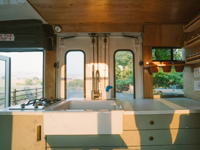 A 39-gallon water tank supplies the kitchen sink. The sink is their favorite feature on the bus, according to the family