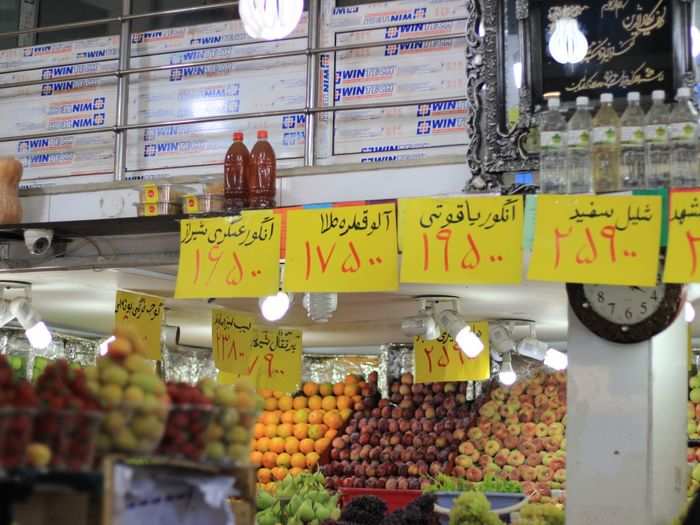 People shop for everyday items such as food at local shops. This shop selling fruits and vegetables is in Vanak, a residential neighbourhood in northern Tehran.