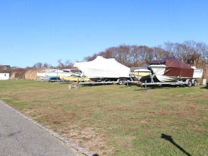 Along with outdoor amenities, residents also have access to a clubhouse. As I walked around, I also found a plot of land filled with parked boats for the winter.