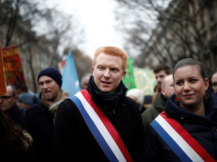 Opposing political parties have joined in, too. Here, members of the French parliament, Adrien Quatennens and Mathilde Panot are seen protesting.