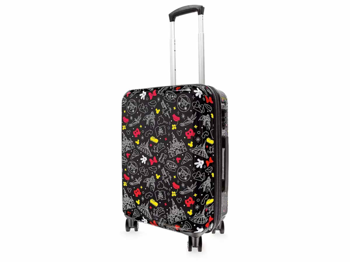 A suitcase with prints of their favorite Disneyland attractions