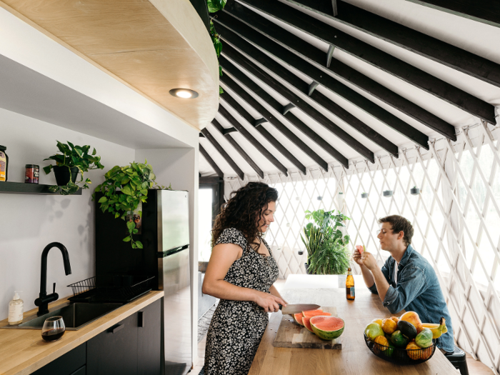 The living space also has a modern, eat-in kitchen.