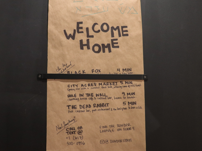 A handwritten note attached to the wall right by the door read: "Welcome home."