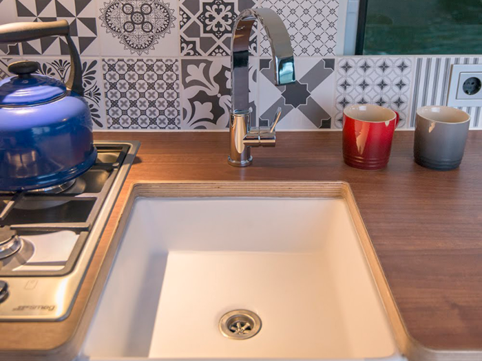 This Moving House created custom sinks for its vans.