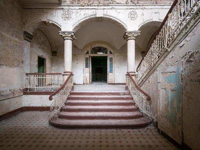 The stunning elegance of staircases like this one stood in contrast to their current state of disrepair.